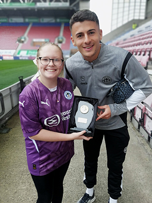 Sam Tickle receiving his away player of the match award