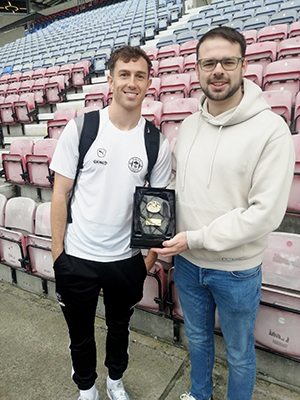 Luke Chambers receiving his away player of the match award